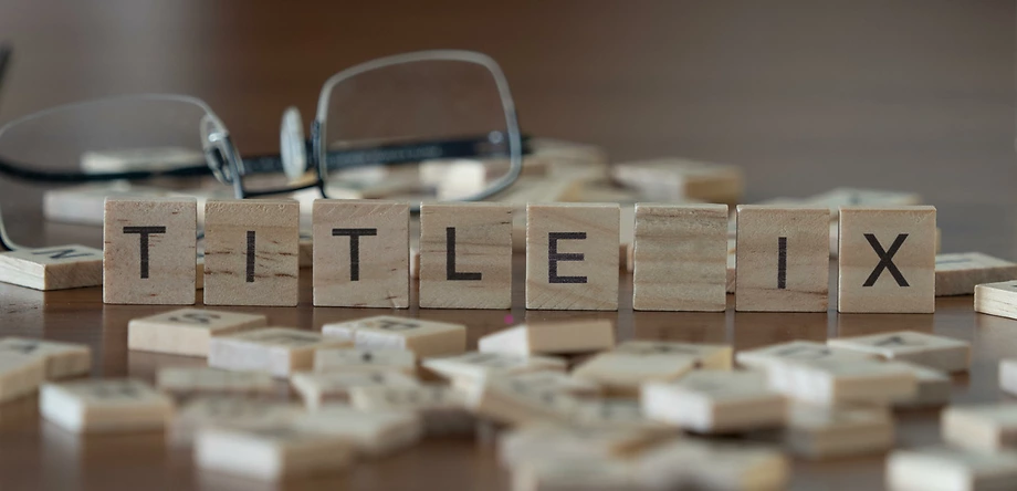 Title IX scrabble tiles on table