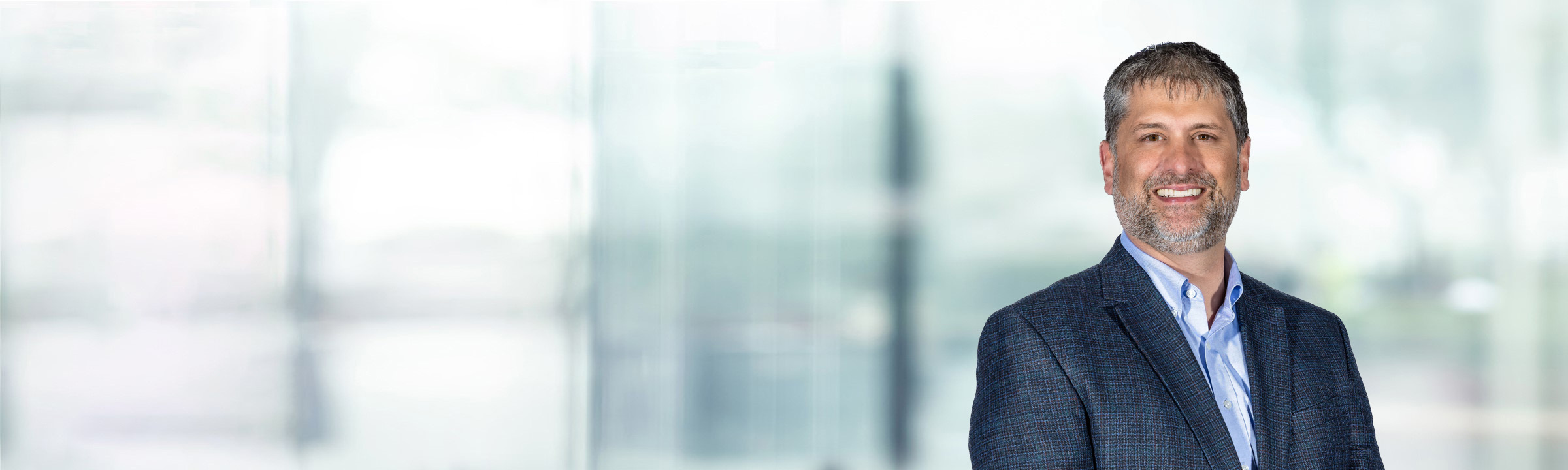 Christopher Canada on light blue and white bokeh banner