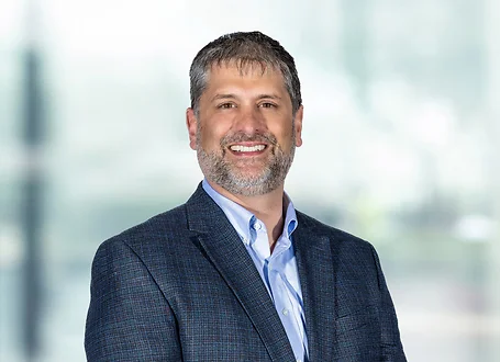 Christopher Canada on light blue and white bokeh banner