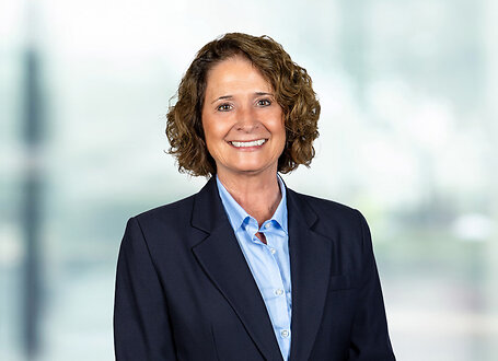 Amy Fitch on light blue and white bokeh banner