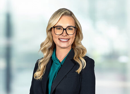 Jenna Rackerby on light blue and white bokeh banner