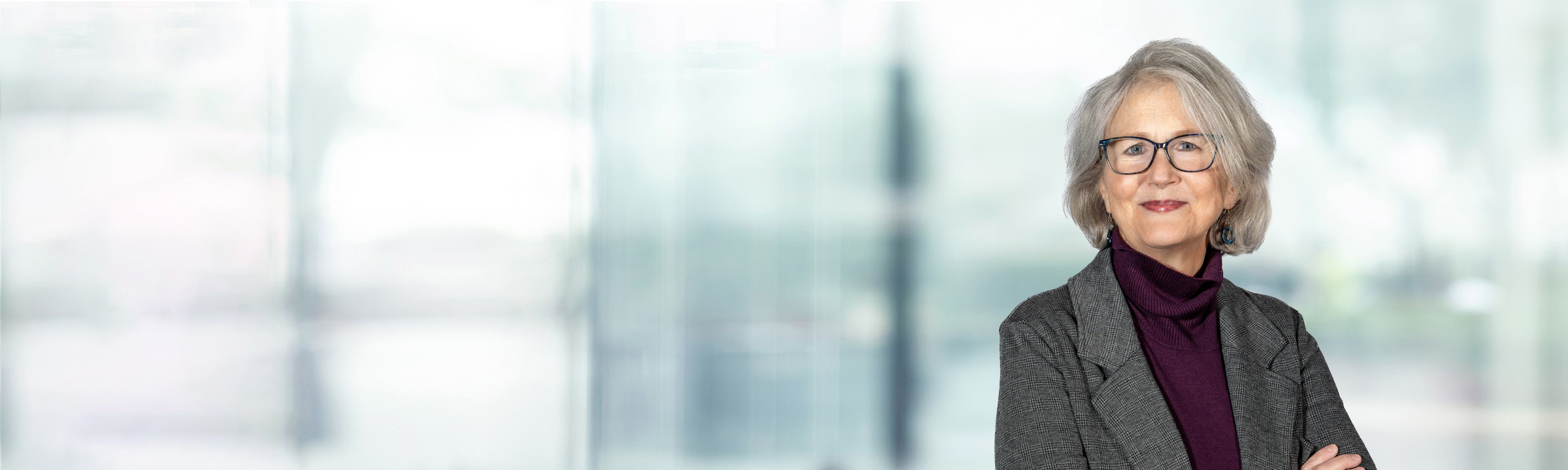 Amy Walters on light blue and white bokeh banner