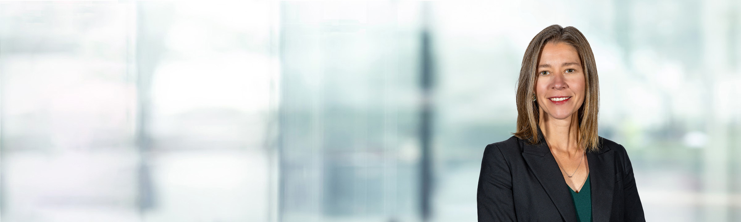 Patricia Heer on light blue and white bokeh banner