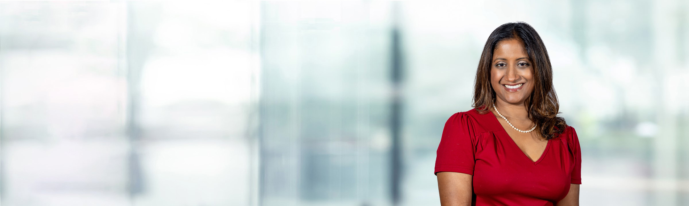 Reetuparna Dutta on light blue and white bokeh banner