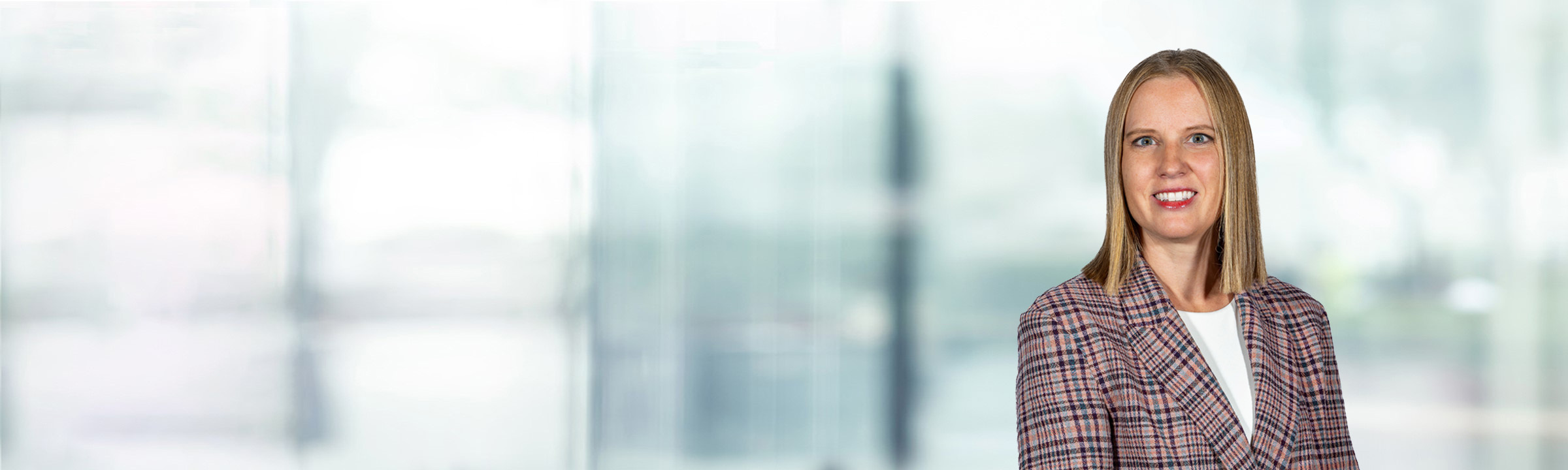 Andrea Gervais on light blue and white bokeh banner