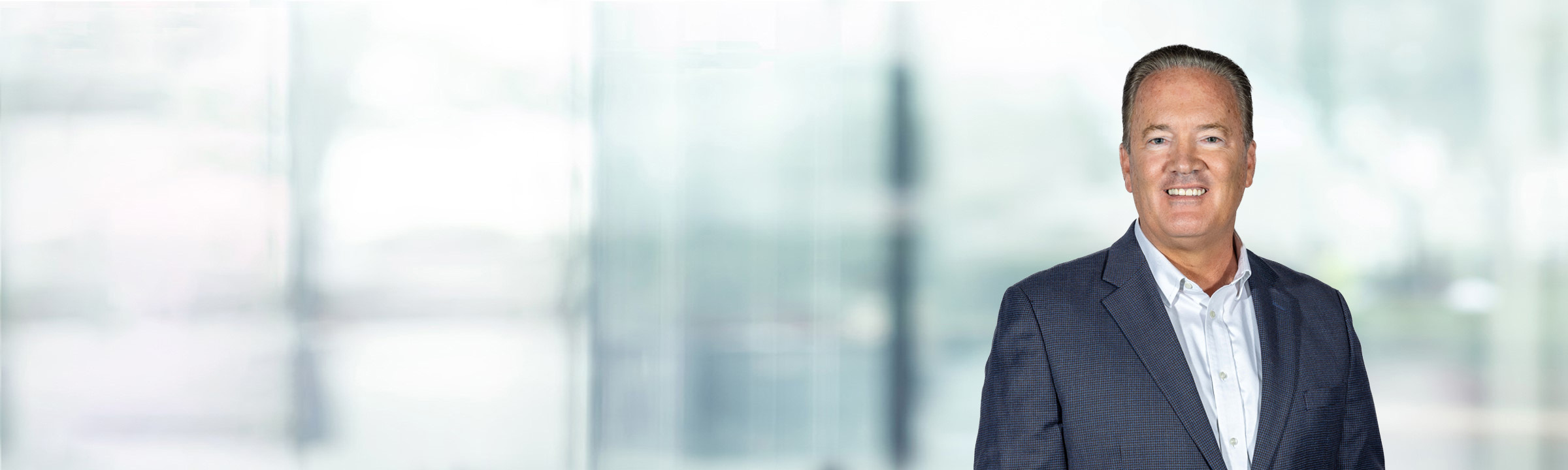 Jeffrey Swiatek on light blue and white bokeh banner