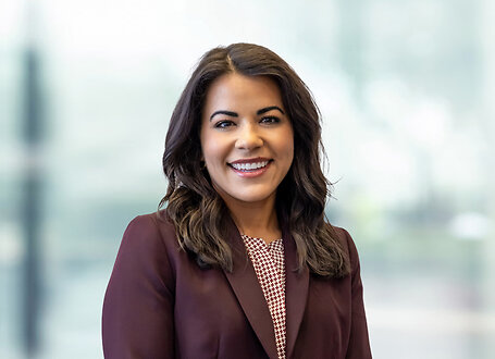 Jennifer Gonzalez on light blue and white bokeh banner