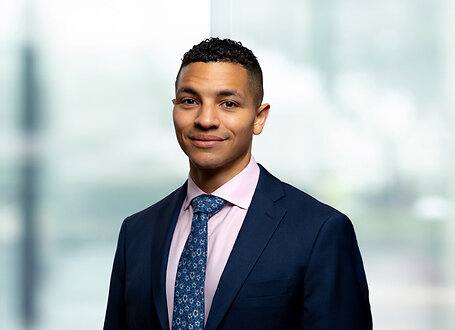 Corben Green on light blue and white bokeh banner