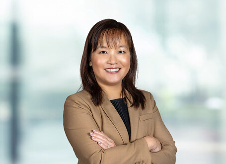 Stephanie Lau on light blue and white bokeh banner