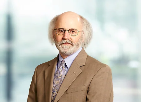 Tom Nelson on light blue and white bokeh banner