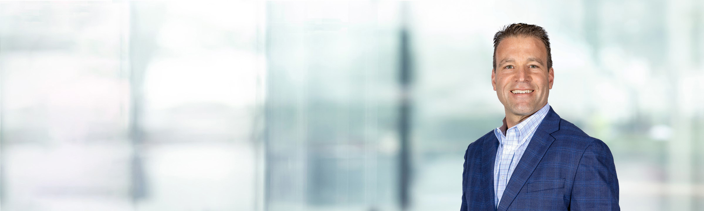 Christian Soller on light blue and white bokeh banner