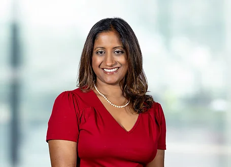 Reetuparna Dutta on light blue and white bokeh banner