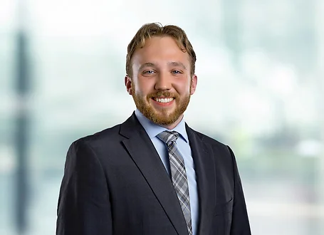 Andrew Cegielski on light blue and white bokeh banner