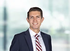 Daniel Chavez on light blue and white bokeh banner