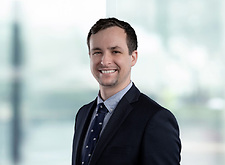 Daniel Pszonak on light blue and white bokeh banner