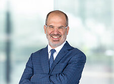 Thomas Berkman on light blue and white bokeh banner