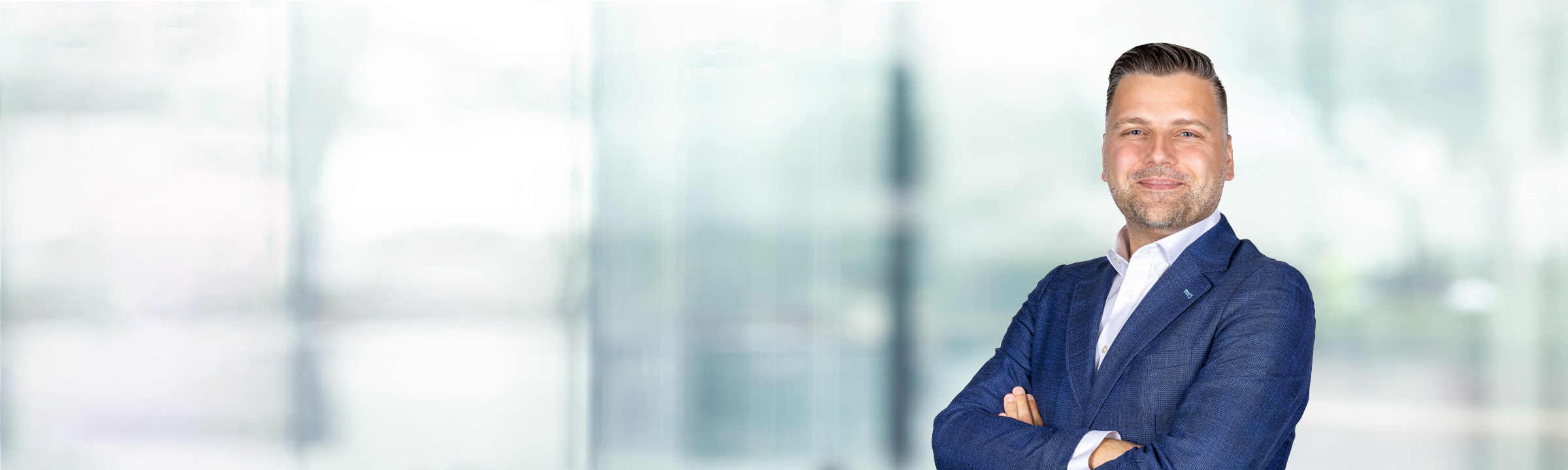 Danijel Augustinovic on light blue and white bokeh banner